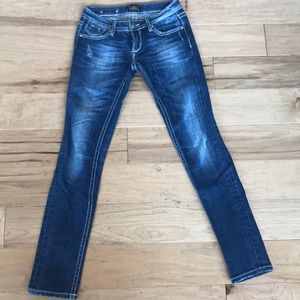 Blue distressed skinny jeans from express